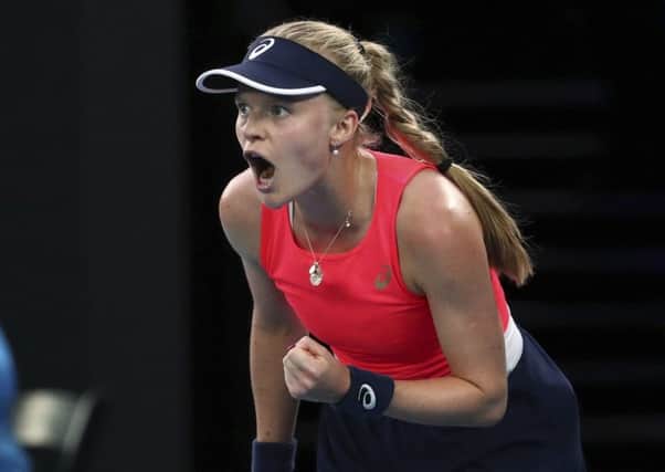 OUT: Harriet Dart reacts during her second round singles match against Romania's Simona Halep in Melbourne. Picture: AP/Dita Alangkara