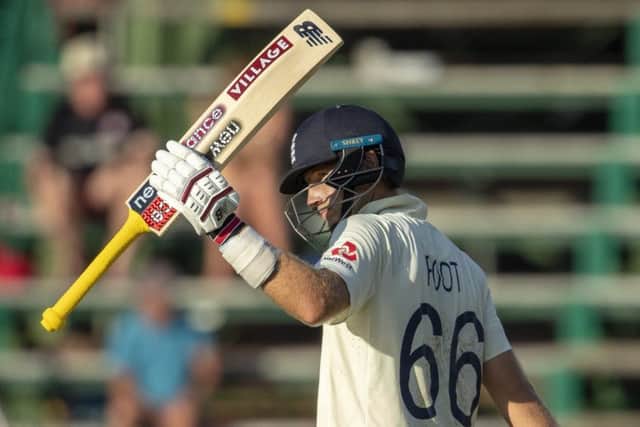 England's captain Joe Root salutes the crowd after reaching his half century.