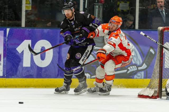 Jonathan Phillips for possession during the first leg of the Challenge Cup semi-final in Glasgow two weeks ago. Picture: Al Goold (www.algooldphoto.com)