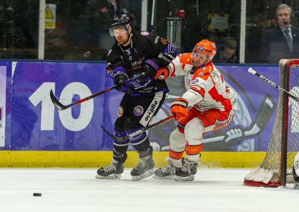 Jonathan Phillips for possession during the first leg of the Challenge Cup semi-final in Glasgow two weeks ago. Picture: Al Goold (www.algooldphoto.com)