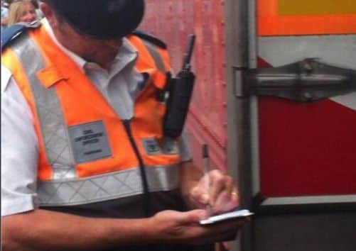 This picture circulated on Twitter of a parking attendant writing a ticket for one of Bruce Springsteen's lorries