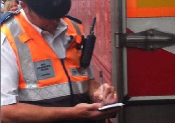 This picture circulated on Twitter of a parking attendant writing a ticket for one of Bruce Springsteen's lorries