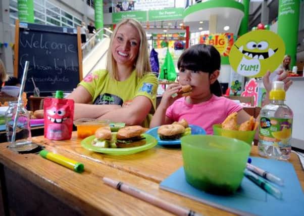 Leah Spears, head of consumer PR for Asda, with taste tester Sienna Magner, four, from Leeds.