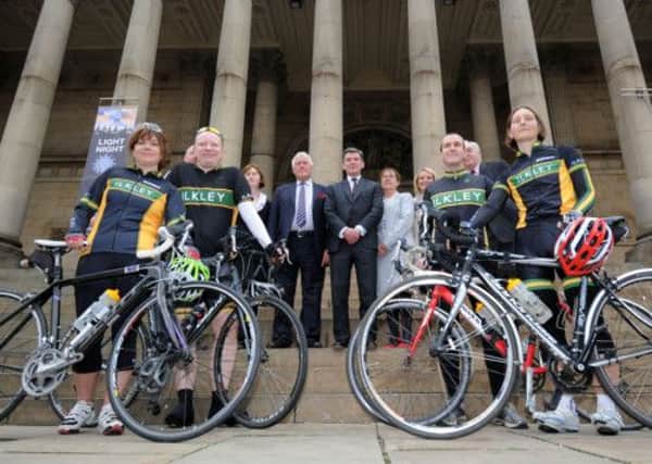 Hugh Robertson, Minister for Sport, meets staff and members of  Ilkley Cycle Club, outside Leeds Town Hall. Picture by Simon Hulme