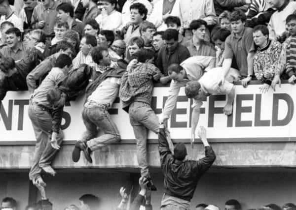 Liverpool fans at Hillsborough, trying to escape severe overcrowding