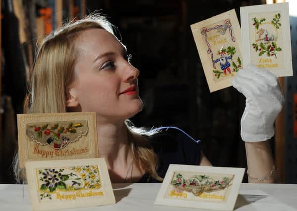Helen Thornton with Christmas Cards from the First World War at York Castle Museum