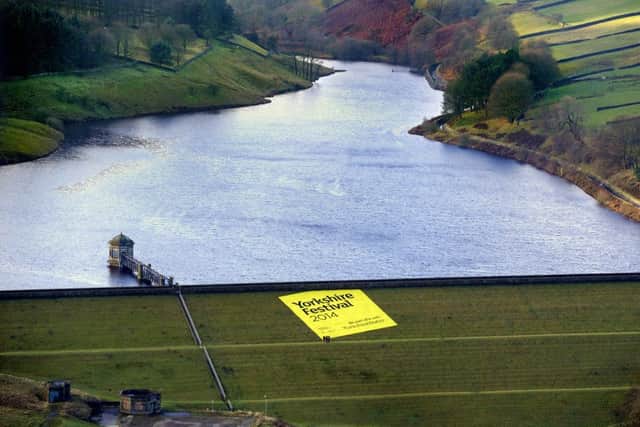 The Yorkshire Festival 2014 has been launched by unveiling of a hugh banner down the the side of Lower Laithe Reservoir near Haworth.