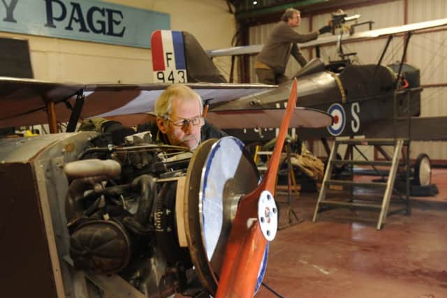 Volunteer Brain Watmough working on the engine of the reproduction 1917 Eastchurch Port Victoria Kitten