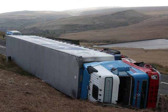 An overturned lorry on the A640 heading towards Oldham.  Picture: Ross Parry Agency