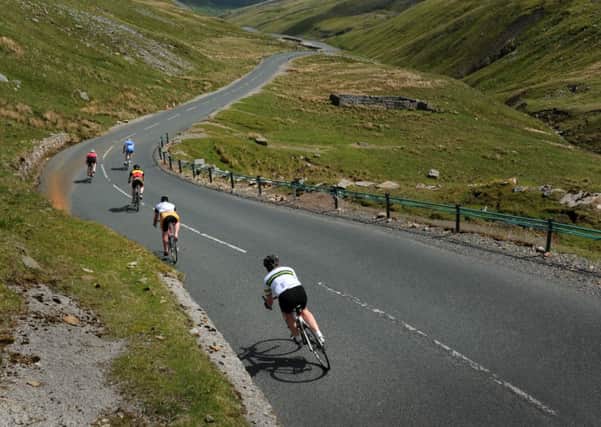 Cycol Rendezvous Tour guest riders descend off Buttertubs pass. Picture Bruce Rollinson