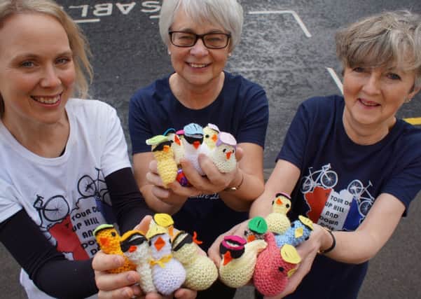 Charitable knitters Louise Flint, Angela Lloyd-Roberts and Lucy Tiffany.