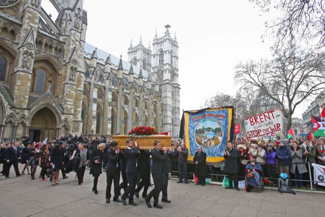 The coffin of former Labour MP and cabinet minister Tony Benn is carried by members of his family following his funeral at St Margaret's Church, Westminster, central London.