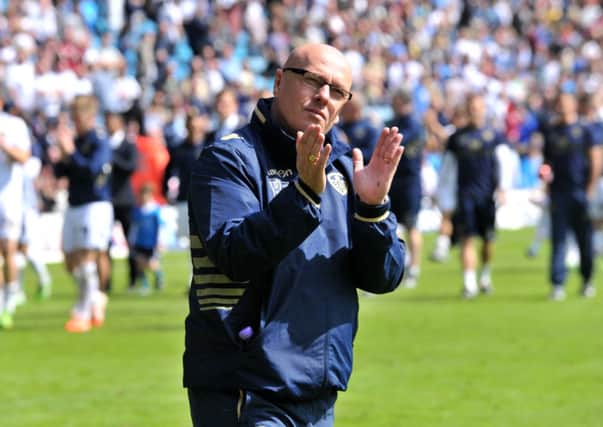 FINAL GOODBYE: Brian McDermott leads his Leeds United team in a lap of honour following the last game of the season 2013-14 season.  Picture Bruce Rollinson.