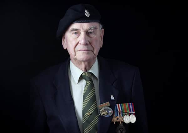 David Render, a 89 year old Normandy veteran from Totteridge Village in north London, with his service medals ahead of his trip to Normandy in France, which is funded by the Big Lottery Fund's Heroes Return scheme