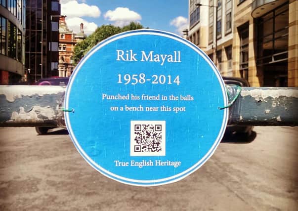 A temporary English Heritage style blue plaque in Hammersmith, west London, dedicated to the comic actor Rik Mayall