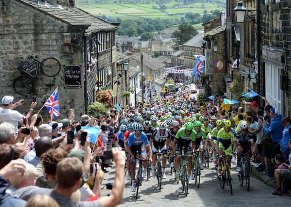 The peloton rides up Main Street in Haworth, and across Yorkshire on Day 2 of the Grand Depart