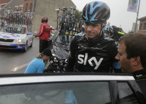 Christopher Froome gets into his team car after abandoning the race.