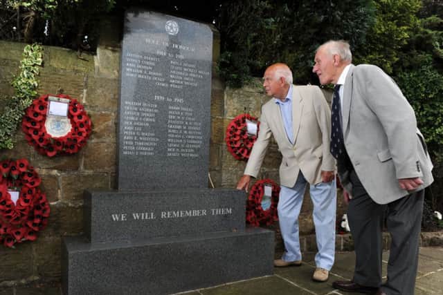 David Marshall (right) and Tony Hodgetts at Bramhope War Memorial. Picture by Bruce Rollinson
