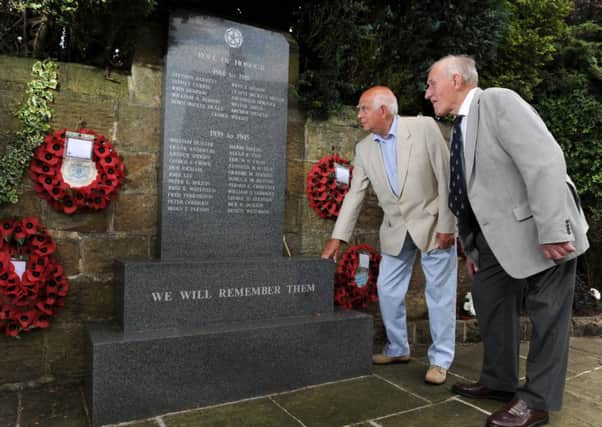 David Marshall (right) and Tony Hodgetts at Bramhope War Memorial. Picture by Bruce Rollinson