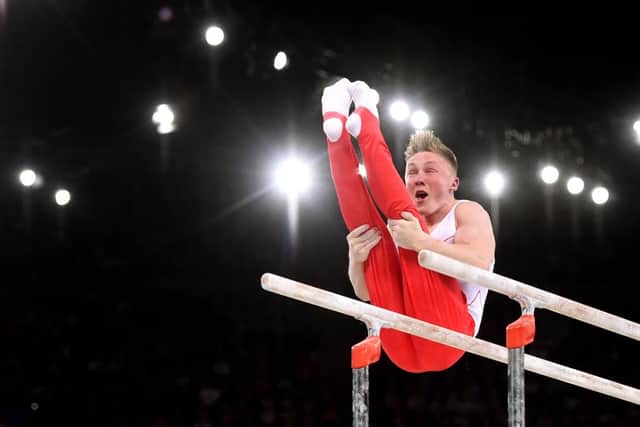 Nile Wilson competes on the Parallel Bars during the Men's Artistic Gymnastic's Team Final