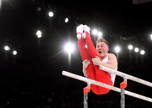 Nile Wilson competes on the Parallel Bars during the Men's Artistic Gymnastic's Team Final