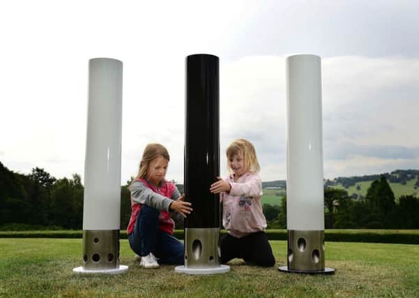 Millie and Ellie Bray from Huddersfield with the Thermin Bollards installation at the Yorkshire Sculpture Park