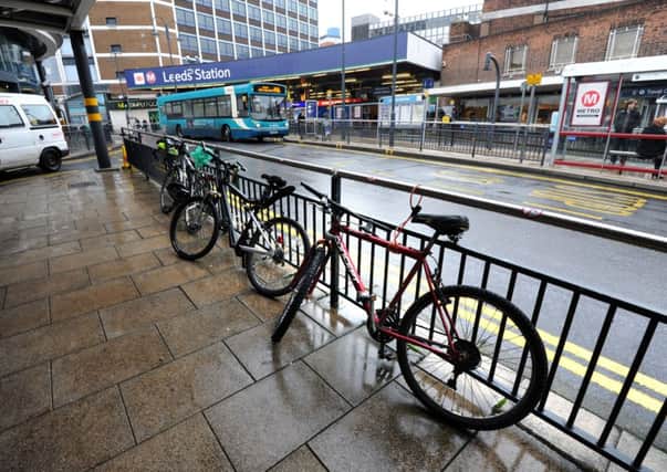 Cycles locked up on railings at Leeds city station. Picture by Mark Bickerdike.
