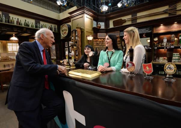 Vince Cable meets apprentices (left to right) Jade Emmett, Imogen Shaw and Rebecca Newell on set at the Woolpack Pub from Emmerdale at the ITV studios in Leeds. PIC: PA