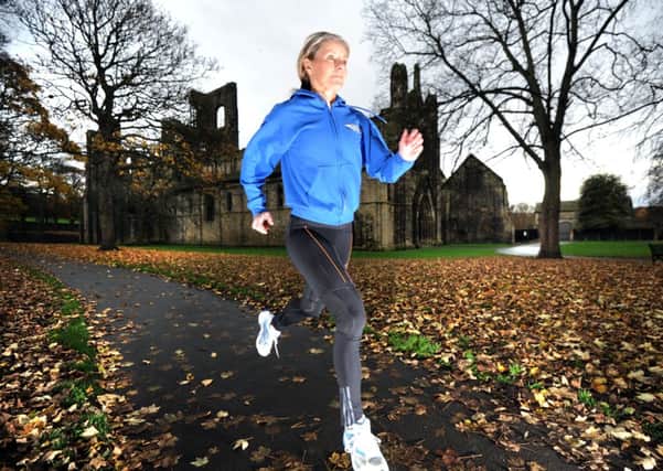 Former Olympic marathon runner Tracey Morris running at Kirkstall Abbey.
