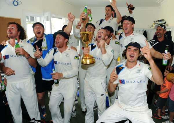 Yorkshire's players celebrate in their dressing room after winning the County Championship.