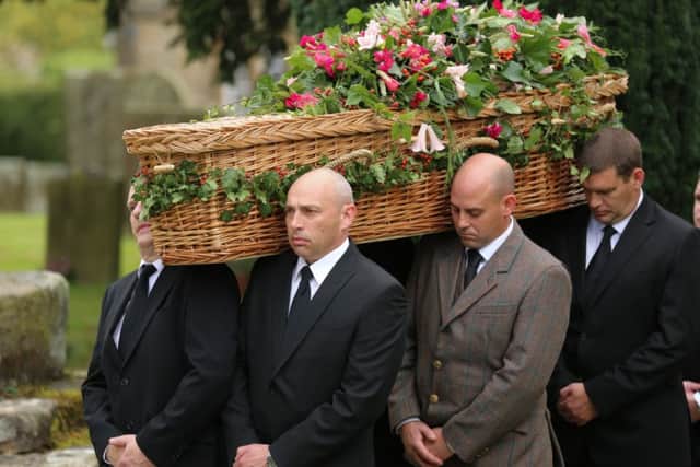The funeral cortege arrives at Edensor for the funeral service. The funeral for the Dowager Duchess of Devonshire at Chatsworth House today October 2 2014. Over 600 staff and thousands of public lined the drive leading to Chatsworth House to pay their respects to the Dowager. Tom Maddick / Rossparry.co.uk