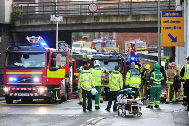 Police and the fire service attend the former gas building in Leeds city centre. 
Pictures by Jonathan Gawthorpe