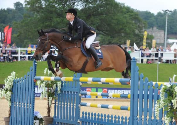 On the way up: William Whitaker showing the style on Upperclass that has taken him up to No 5 in the British show-jumping rankings.