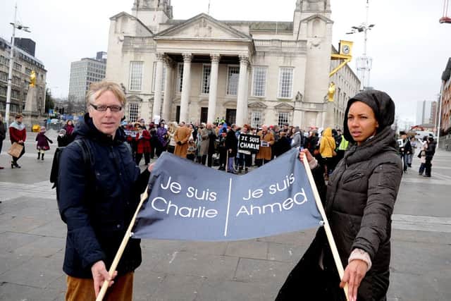 Date:  11th January 2015, (JH1006/80h) Charlie Hebdo vigil held in Millennium, Leeds, organised by (right) French journalist Mireille Mason-Beguin, and her husband Peter Mason.