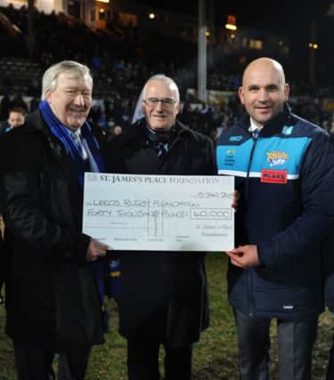 Neil Kaiper Homes, chairman of Leeds Rhinos Foundation, Stephen Mitchell of the St James's Place Foundation and Davide Longo, general manager of Leeds Rhinos Foundation  during half time at the Rhinos v Widnes match
