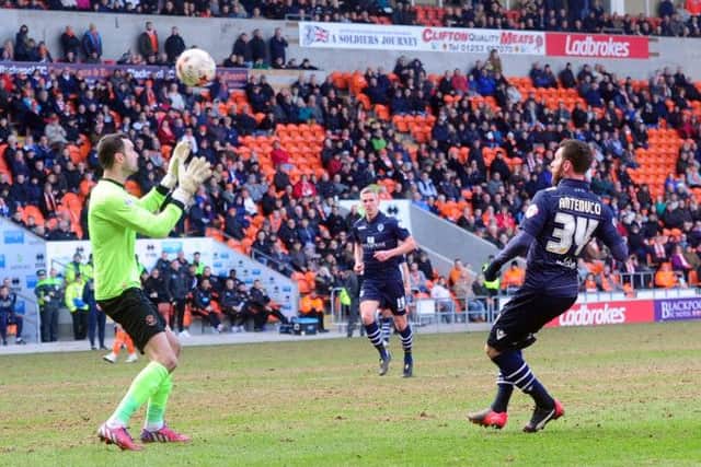 Leeds United substitute striker Mirco Antenucci lobs the ball over Blackpool goalkeeper Joe Lewis to make it 1-1 in Saturdays Championship encounter (Picture: Tony Johnson).