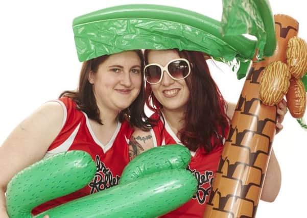 Leeds Roller Dolls are fundraising to travel to Florida to play in an international roller derby tournament, Beach Brawl. Pictured are Emily Morris and Lyndsay Burgan. Picture: Jason Ruffell.
