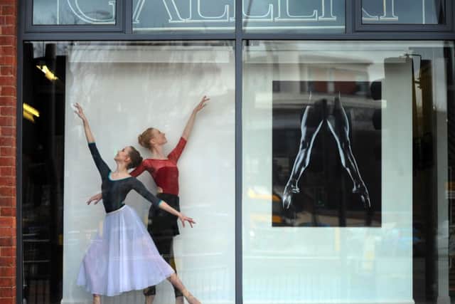 Northern Ballet dancers Alice Bayston and Isabelle Clough  in the window of The Gallery, Munro House.

Picture by Simon Hulme