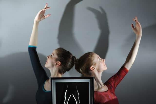 Northern Ballet dancers Alice Bayston and Isabelle Clough, pictured with one of photographer Justin Slee's images from the exhibition
Picture by Simon Hulme