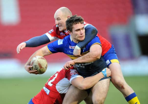Doncaster RLFC v Leeds Rhinos.
Pre-season Friendley.
Rhinos George Milton is tackled by Doncaster's Brad Foster and Shaun Leaf.
1st February 2015.
Picture Jonathan Gawthorpe.