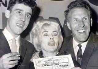 Viv Nicholson and husband Keith collect their Littlewoods pools cheque from Bruce Forsyth