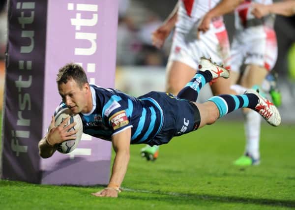 Leeds Rhinos' Danny McGuire scores at Langtree Park. Picture: Steve Riding.