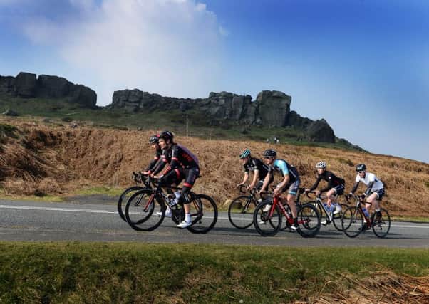 Riders from three of the British Pro teams, Tom Barras NFTO, Pete Williams, One Pro Cycling, and Tobyn Horton, Madison Genesis,  riding the Tour of Yorkshire ride past the Cow and Calf from Ilkley.  Picture by Bruce Rollinson