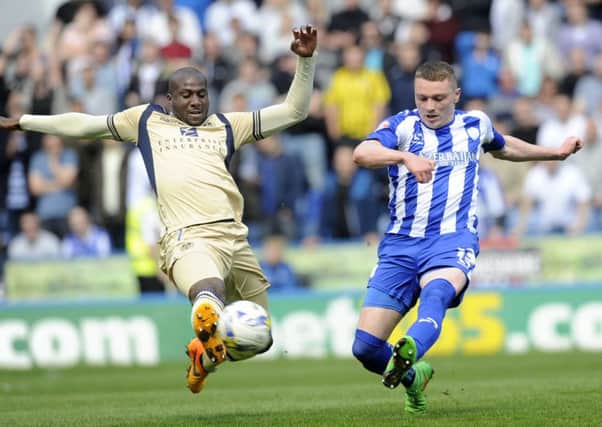 Leeds' Sol Bamba with Owls' Caolan Lavery