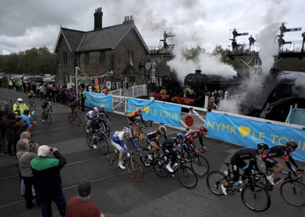 The peloton crosses the North Yorkshire Moors Railway line at Grosmont crossing during the Tour de Yorkshire between Bridlington and Scarborough.