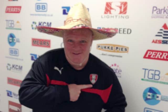 Steve Evans tries on a sombrero for size ahead of the Leeds match