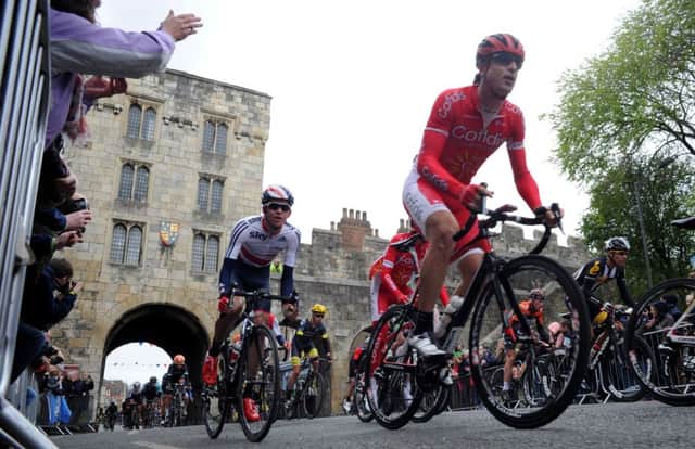 Riders pass crowds in York, during the Tour de Yorkshire between Selby and York.