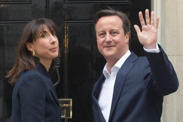 Prime Minister David Cameron and wife Samantha arrive back at 10 Downing Street this morning