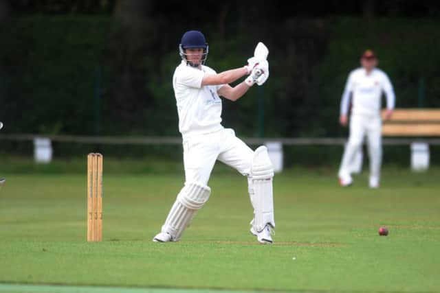 North Leeds's Andrew Carson hits through the covera against Bilton in their Aire-Wharfe encounter. Picture: Steve Riding.