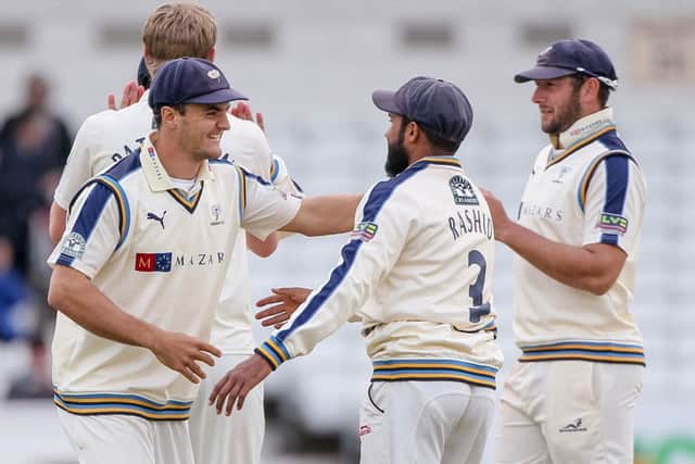 Yorkshire's Jack Brooks (left), Adil Rashid and team-mates celebrate the win.